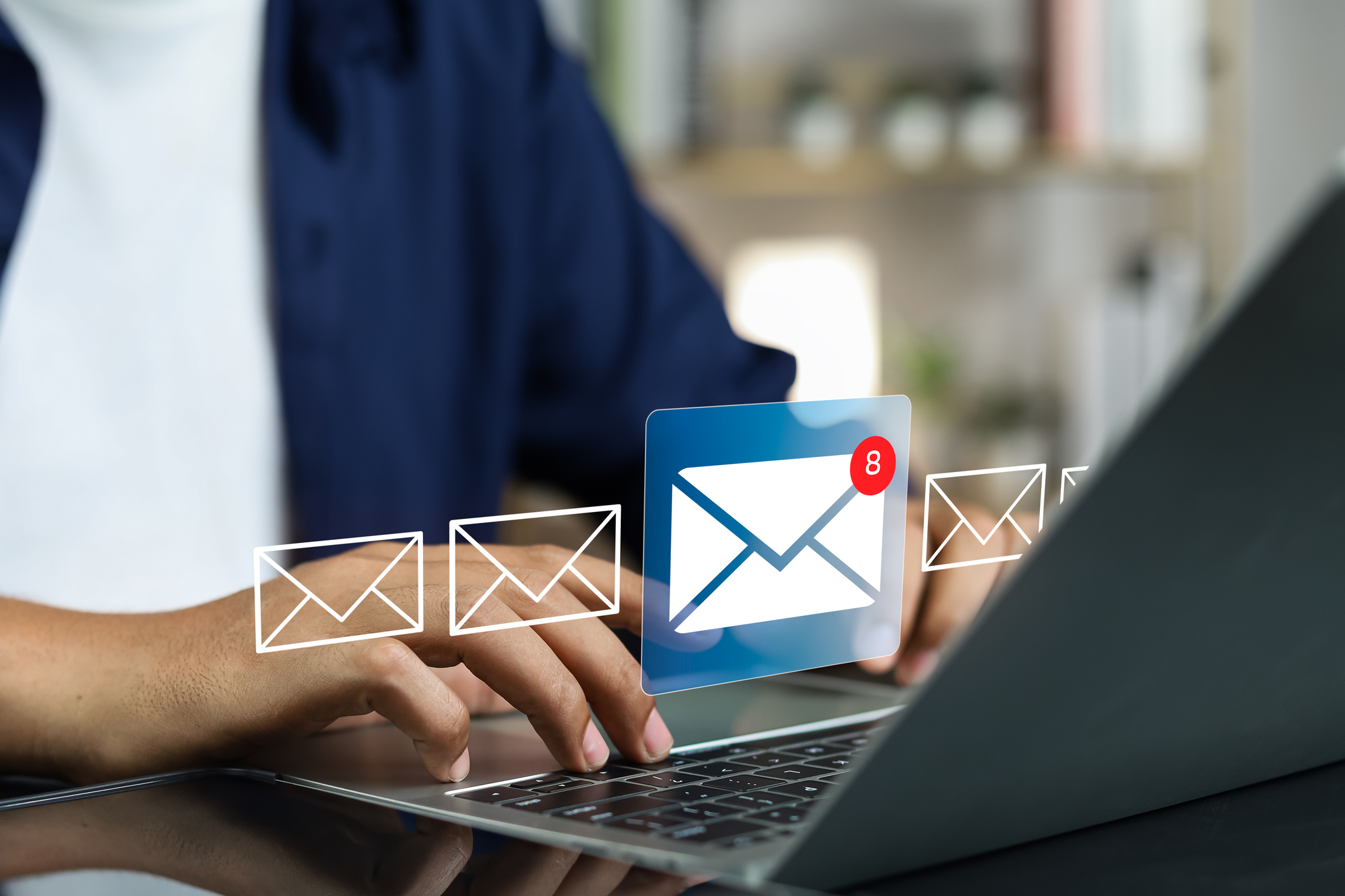 Grafika przedstawiająca mężczyznę z laptopem i odbierającym pocztę e-mail.