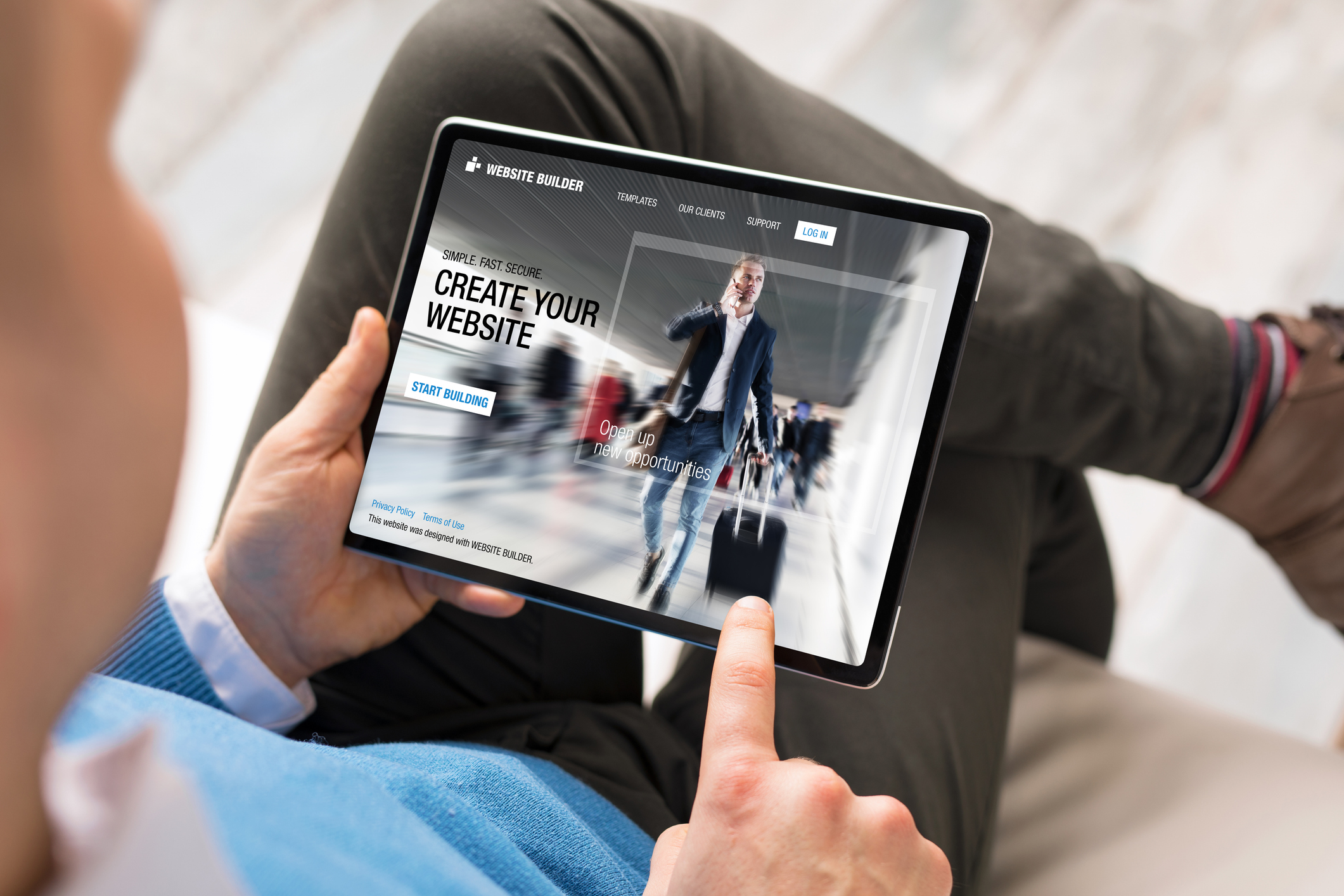 Male using tablet for creating website for his business